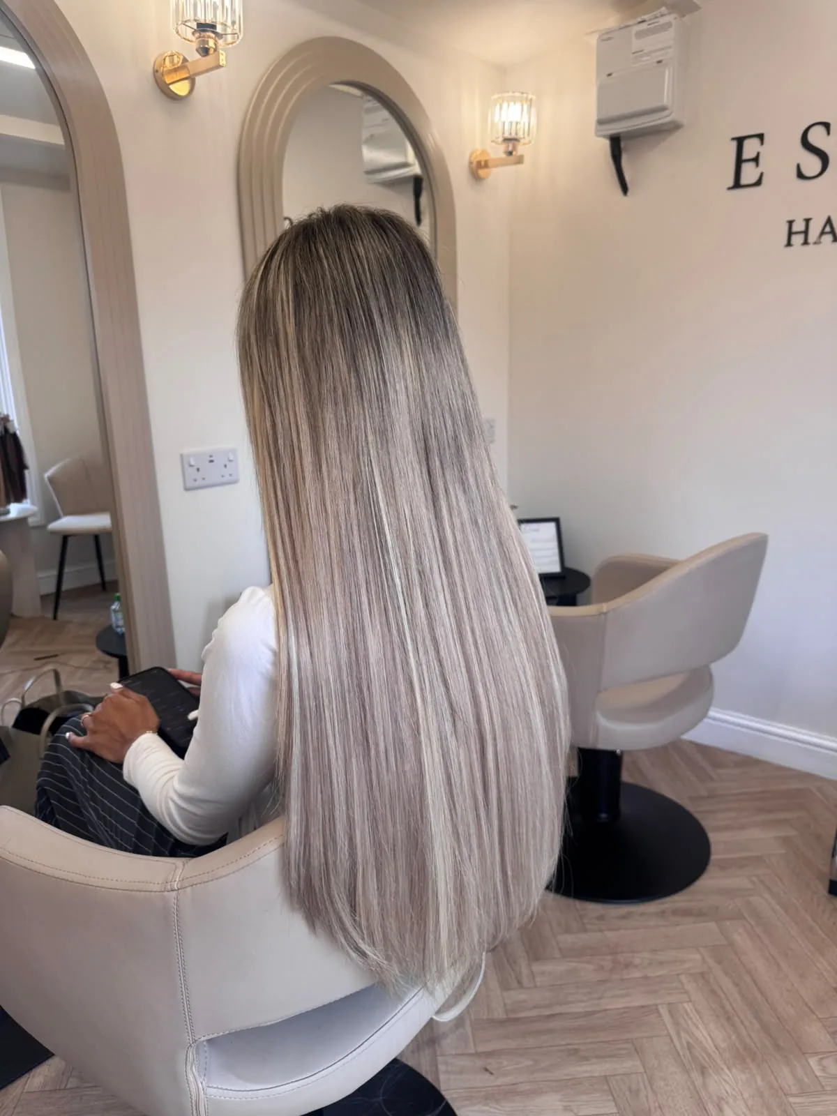 Long icy-blonde balayage with hybrid hair extensions
