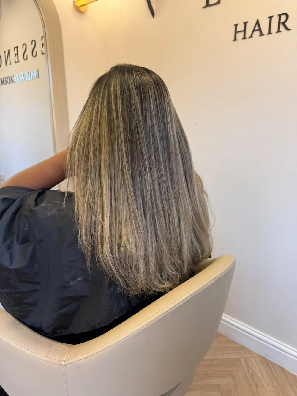 Ash-bronde balayage on straight, mid-length hair